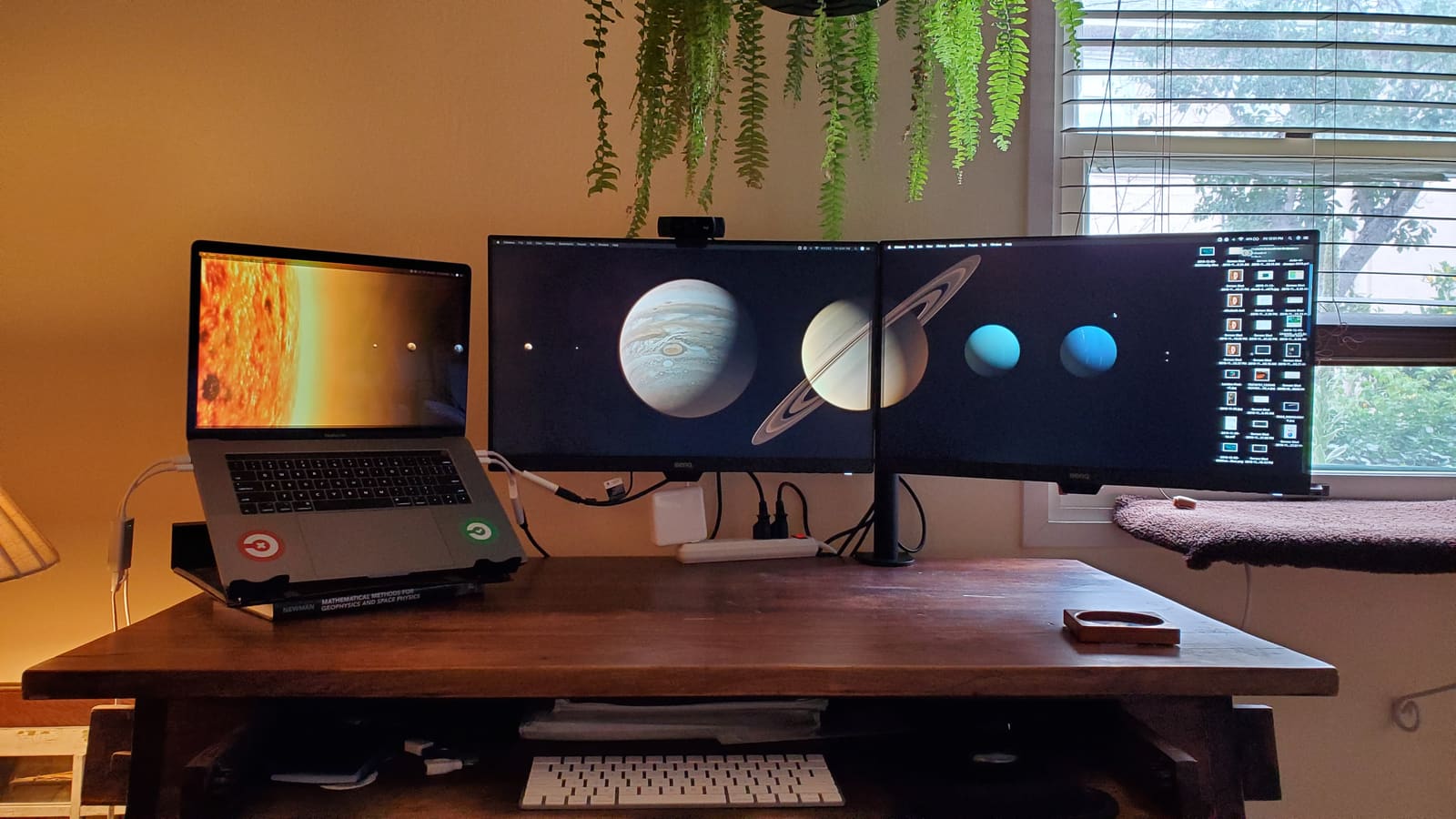 Ron Powell's workspace with a monitor, speakers, and desk setup.